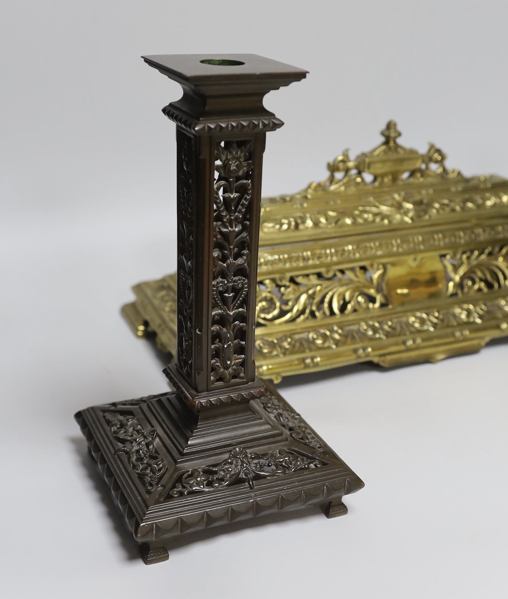 A Victorian cast brass pen and inkstand and a pair of cast brass candlesticks (3) 24.5cm tall
